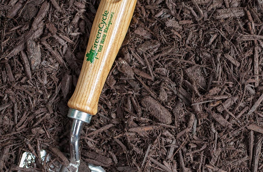 Brown dyed mulch with spade