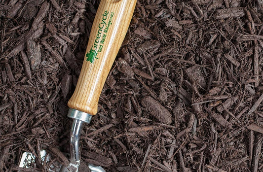 Brown dyed mulch with spade