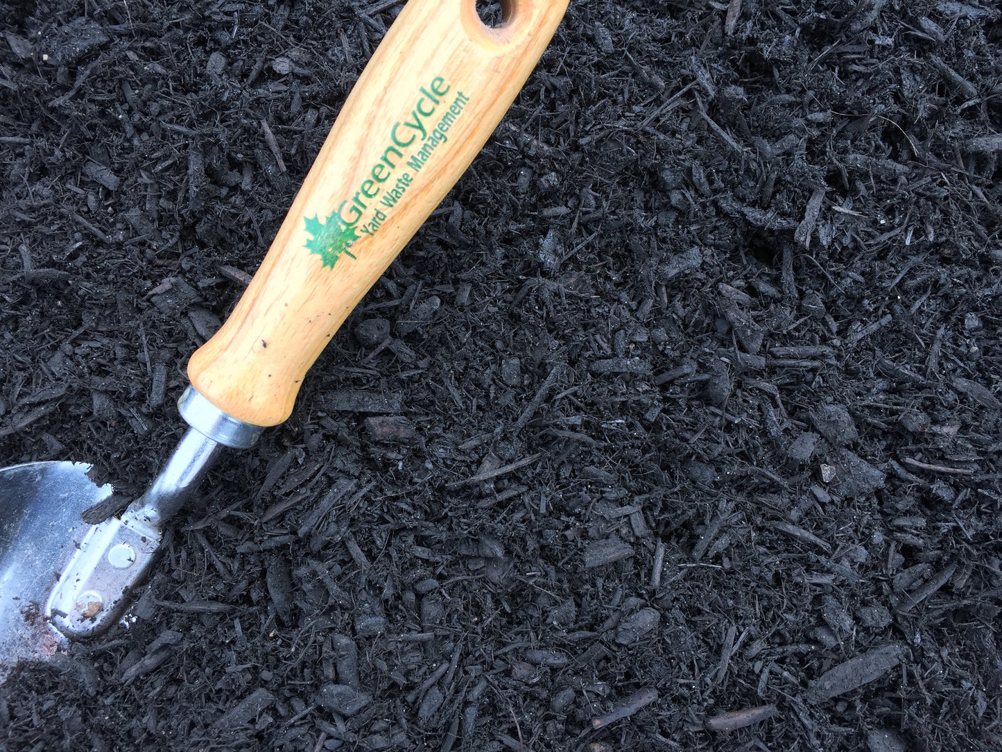 fine grind black dyed mulch with spade