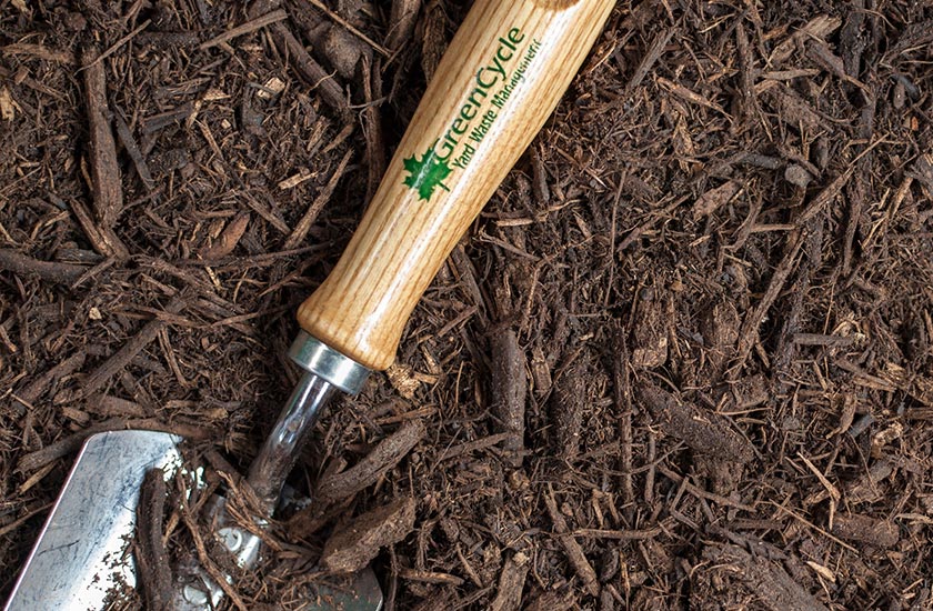premium hardwood mulch with spade